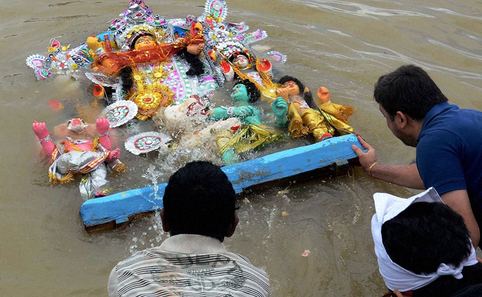 Teary-eyed devotees bade an emotional farewell, as idols of goddess Durga and her children were immersed in ponds, lakes and rivers of West Bengal on Vijaya Dashami on Tuesday, bringing to an end to five days of revelry and celebration associated with the biggest festival of eastern India. (Photo: PTI) Teary-eyed devotees bade an emotional farewell, as idols of goddess Durga and her children were immersed in ponds, lakes and rivers of West Bengal on Vijaya Dashami on Tuesday, bringing to an end to five days of revelry and celebration associated with the biggest festival of eastern India. (Photo: PTI)