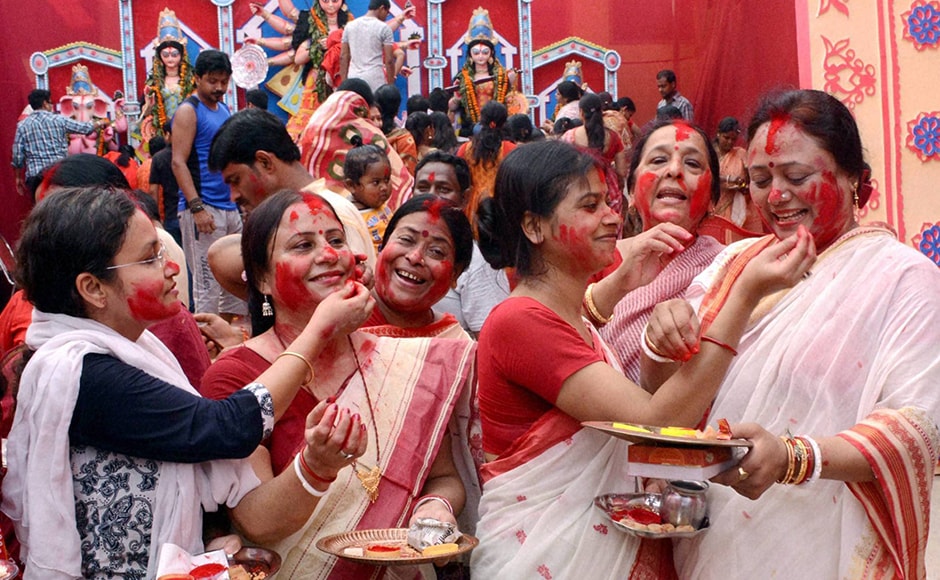 They also offered sweets to the god, and prayed for the well-being of their families and long lives of their husbands while performing these rituals. Married women participate in Sindur Khela during Durga Puja festival in Lucknow on Tuesday. (Photo: PTI) They also offered sweets to the god, and prayed for the well-being of their families and long lives of their husbands while performing these rituals. Married women participate in Sindur Khela during Durga Puja festival in Lucknow on Tuesday. (Photo: PTI)