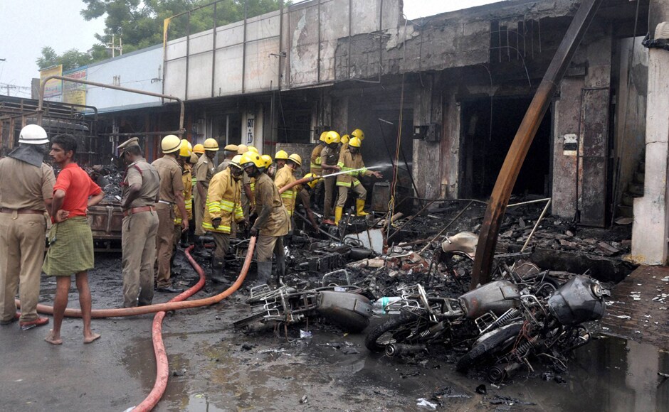 Sivakasi: Fire fighters trying to douse the fire that broke down at a godown containing crackers in Sivakasi in Tamil Nadu on Thursday. PTI Photo (PTI10_20_2016_000246B) Sivakasi: Fire fighters trying to douse the fire that broke down at a godown containing crackers in Sivakasi in Tamil Nadu on Thursday. PTI Photo (PTI10_20_2016_000246B)