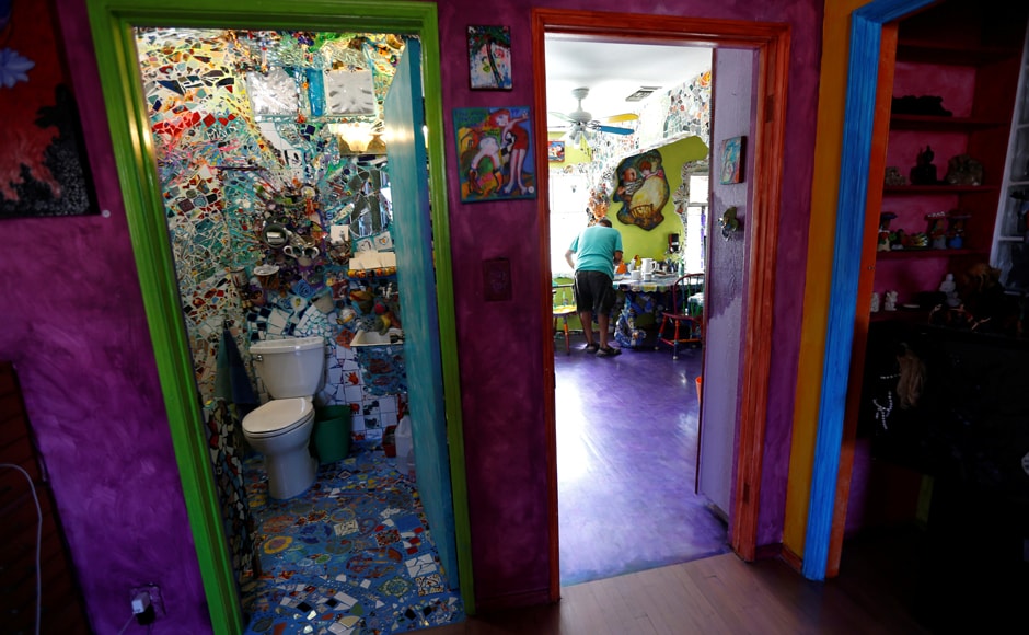 Artist Gonzalo Duran works in his kitchen as a bathroom is shown at his and artist Cheri Pann's Mosaic Tile House in Venice, California, US. Image from Reuters Artist Gonzalo Duran works in his kitchen as a bathroom is shown at his and artist Cheri Pann's Mosaic Tile House in Venice, California, US. Image from Reuters