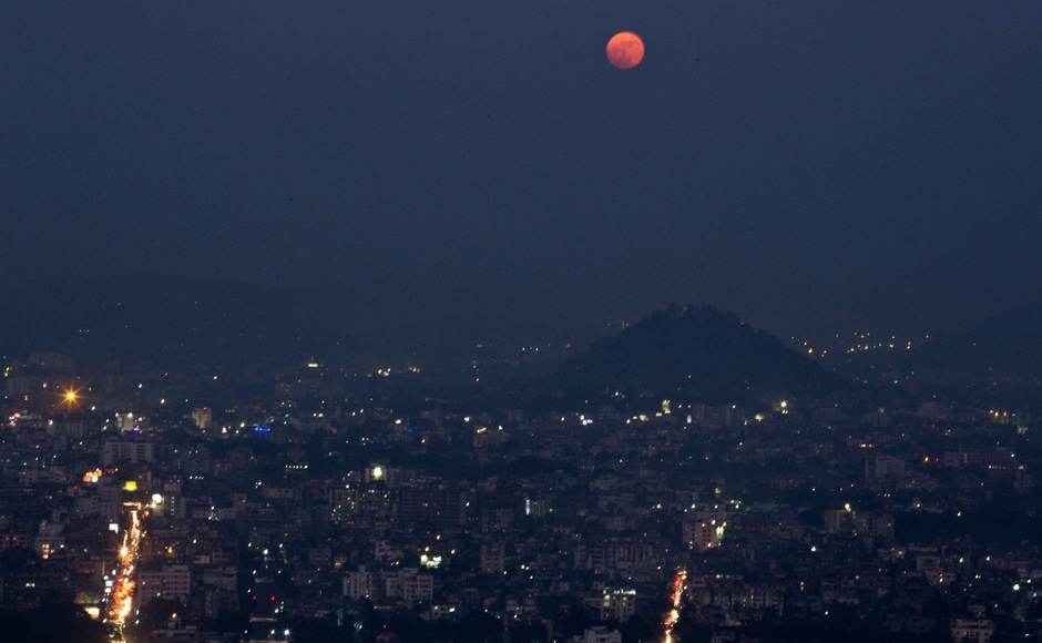 The moon rises in Gauhati, northeastern Assam state, India. AP The moon rises in Gauhati, northeastern Assam state, India. AP