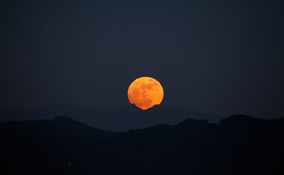 The moon rises behind the mountain range seen from Naypyitaw, Myanmar. The brightest moon in almost 69 years lights up the sky in a treat for star watchers around the globe. AP The moon rises behind the mountain range seen from Naypyitaw, Myanmar. The brightest moon in almost 69 years lights up the sky in a treat for star watchers around the globe. AP