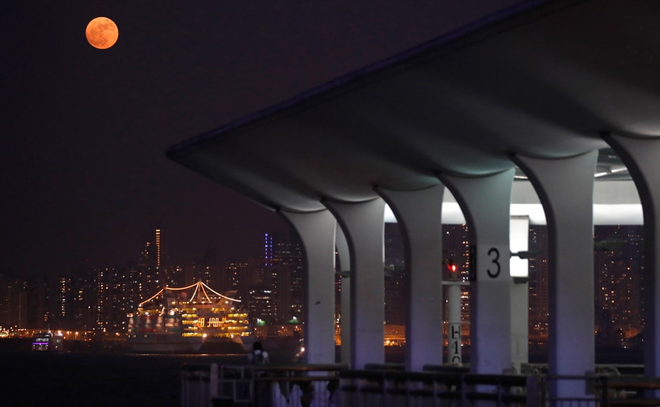 The moon rises over Victoria Harbour in Hong Kong. AP The moon rises over Victoria Harbour in Hong Kong. AP