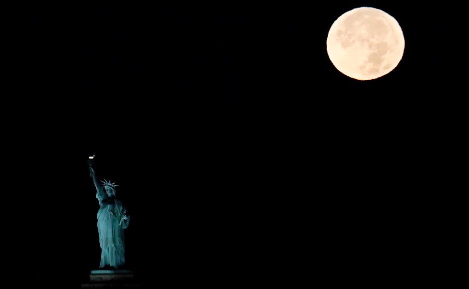 The supermoon sets behind the Statue of Liberty in New York. Monday's supermoon, a phenomenon that happens when the moon makes a close pass at the earth, is the closest to earth since 1948. AP The supermoon sets behind the Statue of Liberty in New York. Monday's supermoon, a phenomenon that happens when the moon makes a close pass at the earth, is the closest to earth since 1948. AP