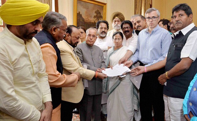 President Pranab Mukherjee receives a memorandum from West Bengal Chief Minister Mamata Bannerjee, AAP leader Bhagwant Mann, National Conference leader Omar Abdullah and a delegation of MPs over demonetisation issue, at Rashtrapati Bhavan in New Delhi. PTI President Pranab Mukherjee receives a memorandum from West Bengal Chief Minister Mamata Bannerjee, AAP leader Bhagwant Mann, National Conference leader Omar Abdullah and a delegation of MPs over demonetisation issue, at Rashtrapati Bhavan in New Delhi. PTI