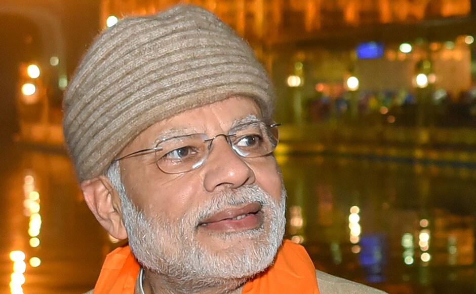 Indian Prime Minister Narendra Modi pays respects at the Golden temple in Amritsar on December 3, 2016.<br />Modi visited the city to participate in the 6th Heart of Asia (HoA) Ministerial Conference. / AFP PHOTO / NARINDER NANU Indian Prime Minister Narendra Modi pays respects at the Golden temple in Amritsar on December 3, 2016.<br />Modi visited the city to participate in the 6th Heart of Asia (HoA) Ministerial Conference. / AFP PHOTO / NARINDER NANU
