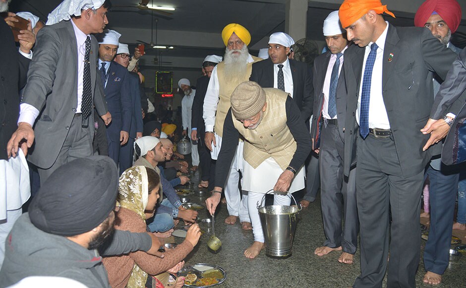 Narendra Modi also distributed food to devotees at the Golden Temple, thus becoming the first Prime Minister to serve the community kitchen, or langar, at the holiest of Sikh shrines in this Punjab city. AFP Narendra Modi also distributed food to devotees at the Golden Temple, thus becoming the first Prime Minister to serve the community kitchen, or langar, at the holiest of Sikh shrines in this Punjab city. AFP