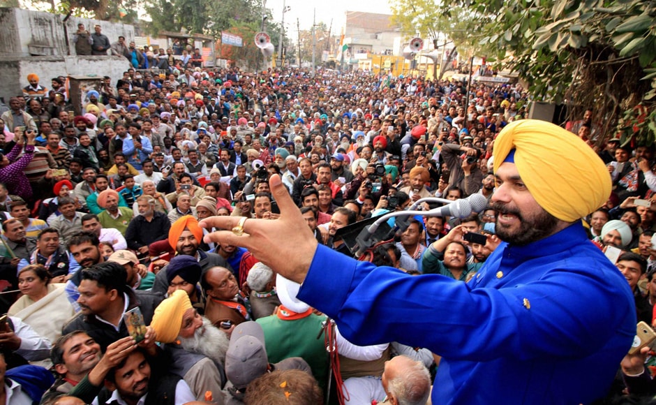 Congress leader Navjot Singh Sidhu addressing an elections rally in support of party candidate Manpreet Singh Badal in Bathinda. Sidhu was a BJP star campaigner in previous elections and also a Rajya Sabha MP. He later quit BJP, apparently miffed as he was denied a ticket from his traditional Amritsar seat in the elections. After many flip flops, he finally settled for the BJP's arch rival. "I am a born Congressman, this is homecoming to me," Sidhu was recently quoted as saying. PTI Congress leader Navjot Singh Sidhu addressing an elections rally in support of party candidate Manpreet Singh Badal in Bathinda. Sidhu was a BJP star campaigner in previous elections and also a Rajya Sabha MP. He later quit BJP, apparently miffed as he was denied a ticket from his traditional Amritsar seat in the elections. After many flip flops, he finally settled for the BJP's arch rival. "I am a born Congressman, this is homecoming to me," Sidhu was recently quoted as saying. PTI
