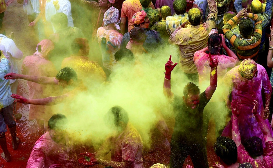 People throw coloured powder during Holi celebrations in the town of Barsana in the state of Uttar Pradesh. Reuters People throw coloured powder during Holi celebrations in the town of Barsana in the state of Uttar Pradesh. Reuters