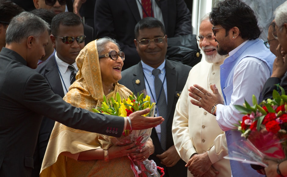 Indian protocol officer, left, introduces Indian Minister of State for Heavy Industries and Public Enterprises, Babul Supriyo, right, to Sheikh Hasina as Modi watches upon her arrival in New Delhi. AP Indian protocol officer, left, introduces Indian Minister of State for Heavy Industries and Public Enterprises, Babul Supriyo, right, to Sheikh Hasina as Modi watches upon her arrival in New Delhi. AP
