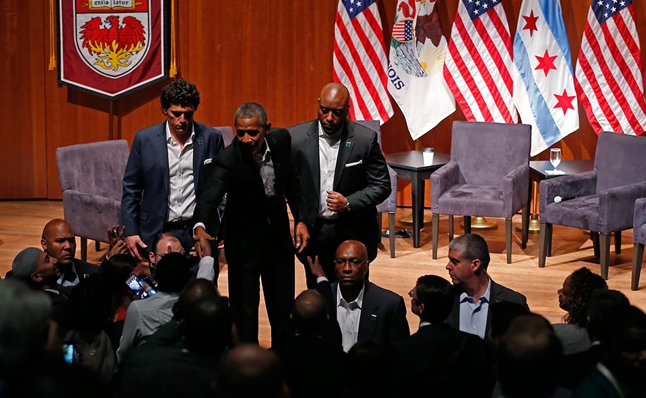 Barack Obama greets audience members after a forum with young leaders to discuss community organising at the University of Chicago in Chicago, Illinois on 24 April. His first public engagement Monday came as President Donald Trump neared his 100-day mark in office. AP Barack Obama greets audience members after a forum with young leaders to discuss community organising at the University of Chicago in Chicago, Illinois on 24 April. His first public engagement Monday came as President Donald Trump neared his 100-day mark in office. AP