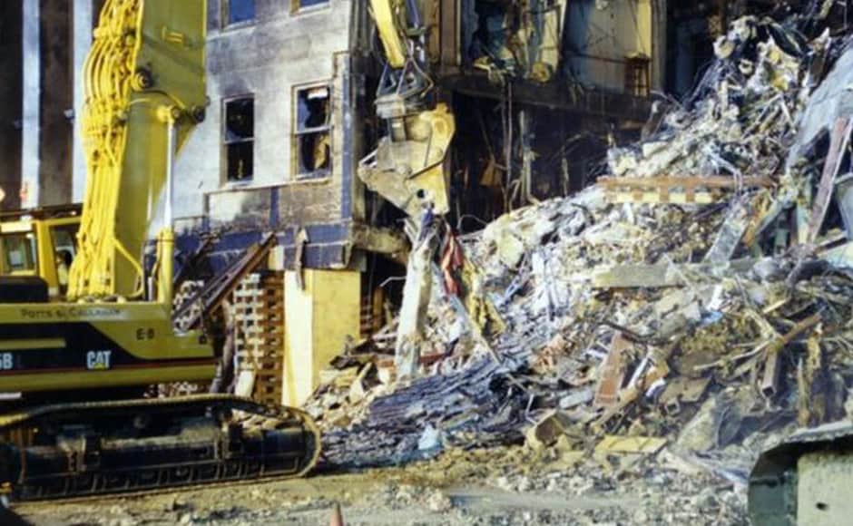 An excavator appears to remove a shredded American flag in this photo which is labelled "Pentagon Exterior". Photo courtesy: FBI An excavator appears to remove a shredded American flag in this photo which is labelled "Pentagon Exterior". Photo courtesy: FBI