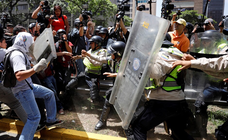 In cat-and-mouse skirmishes on backstreets and highways around the capital, youths built barricades, burned trash and hurled rocks and bottles at soldiers and police. Reuters In cat-and-mouse skirmishes on backstreets and highways around the capital, youths built barricades, burned trash and hurled rocks and bottles at soldiers and police. Reuters