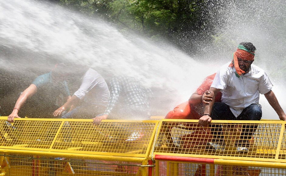 The BJP activists gathered near Taj Mansingh hotel and worshipped a calf. They broke police barricades during the march and police personnel used water canon to try and contain the protest. PTI The BJP activists gathered near Taj Mansingh hotel and worshipped a calf. They broke police barricades during the march and police personnel used water canon to try and contain the protest. PTI