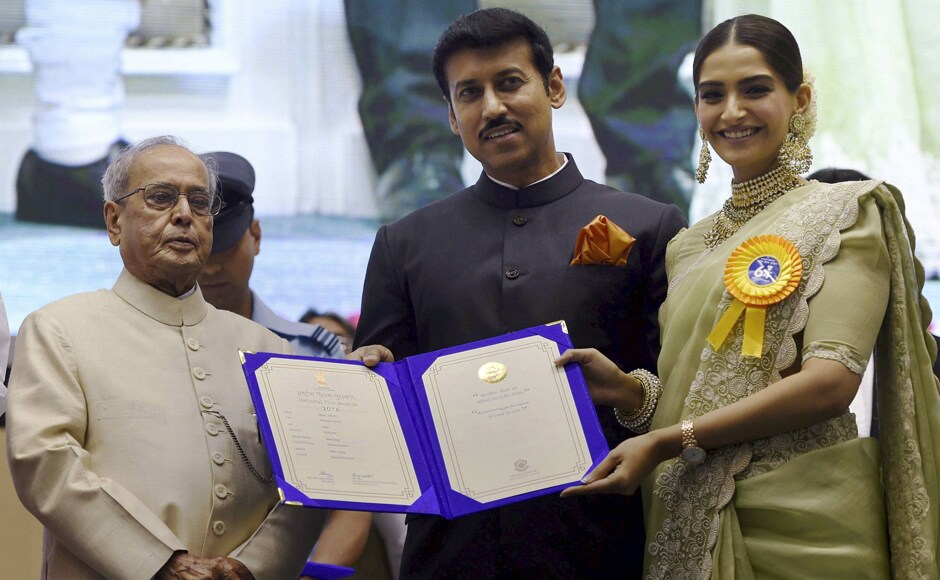 Pranab Mukherjee and Rajyavardhan Singh Rathore present Best Hindi Film Award to Sonam Kapoor for Neerja. PTI Pranab Mukherjee and Rajyavardhan Singh Rathore present Best Hindi Film Award to Sonam Kapoor for Neerja. PTI