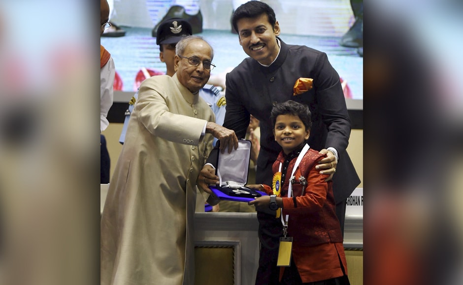 President Pranab Mukherjee and Rajyavardhan Singh Rathore present Best Child Actor Award to Adish Praveen for Kunju Daivam (Malayalam). PTI President Pranab Mukherjee and Rajyavardhan Singh Rathore present Best Child Actor Award to Adish Praveen for Kunju Daivam (Malayalam). PTI