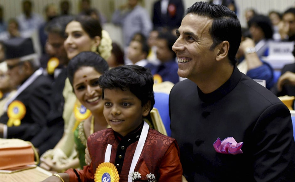 Best Actress Award winner Surabhi CM, child actor Adish Praveen and Akshay Kumar. PTI Best Actress Award winner Surabhi CM, child actor Adish Praveen and Akshay Kumar. PTI
