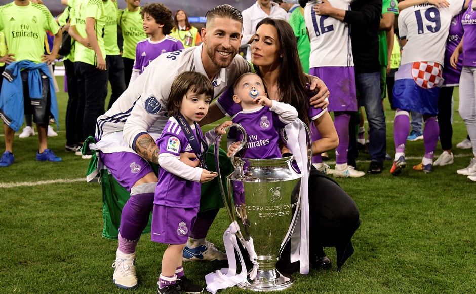 Real Madrid captain Sergio Ramos, his wife Pilar Rubio and their sons Sergio and Marco pose with the trophy after Real Madrid won the UEFA Champions League. AFP Real Madrid captain Sergio Ramos, his wife Pilar Rubio and their sons Sergio and Marco pose with the trophy after Real Madrid won the UEFA Champions League. AFP