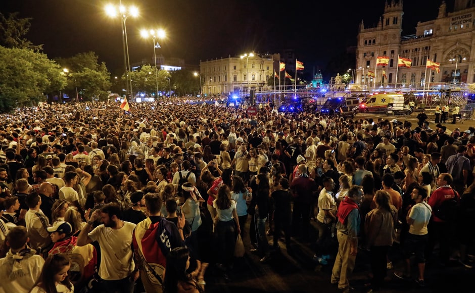 Real Madrid fans celebrating their team's triumph in Madrid. AFP Real Madrid fans celebrating their team's triumph in Madrid. AFP
