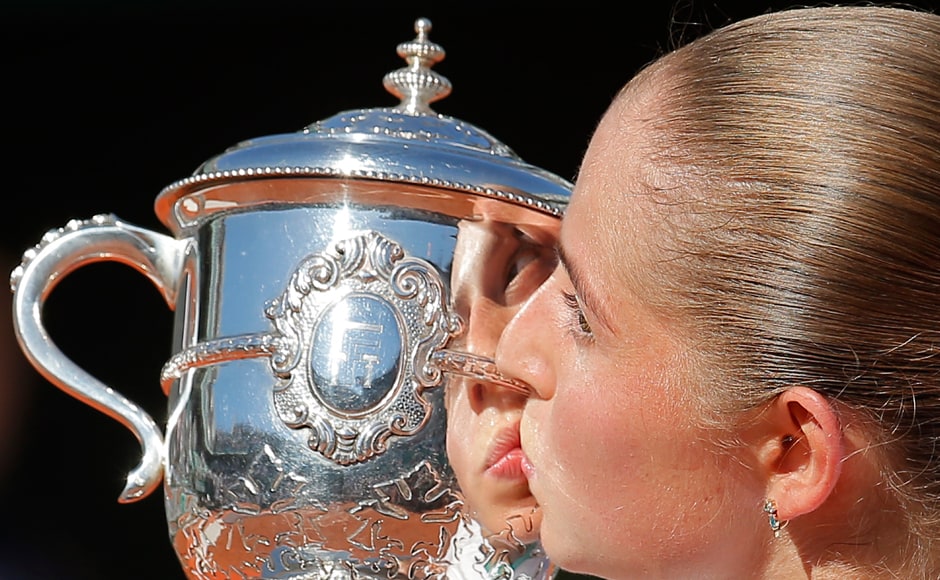 Twenty-year-old Jelena Ostapenko kisses the cup after defeating Simona Halep in the final of the French Open. AP Twenty-year-old Jelena Ostapenko kisses the cup after defeating Simona Halep in the final of the French Open. AP