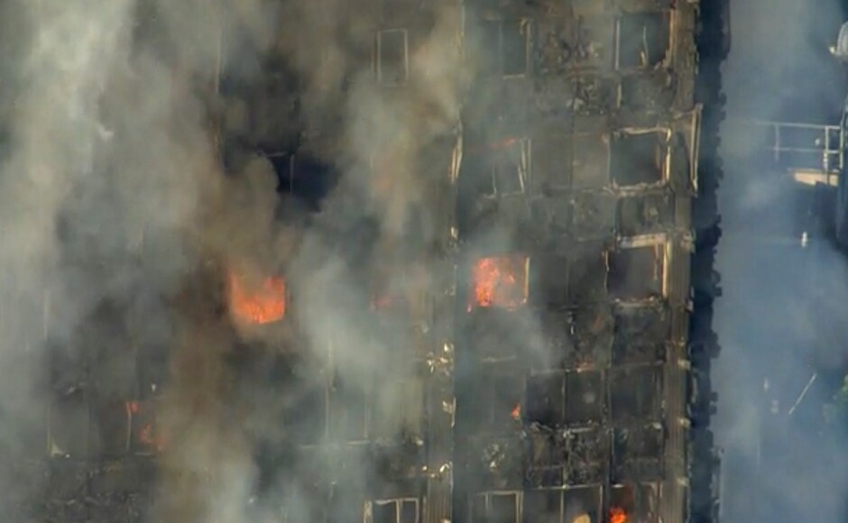 Large pieces of debris could be seen falling from the tower, located in the British capital's north Kenisington area, a short distance from chic Notting Hill. Eyewitness said that they had seen some people fall or jump from the building. AP Large pieces of debris could be seen falling from the tower, located in the British capital's north Kenisington area, a short distance from chic Notting Hill. Eyewitness said that they had seen some people fall or jump from the building. AP