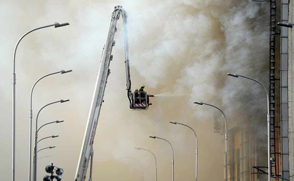 The intensity of the blaze was such that five floors collapsed after almost 24 hours since the fire broke out. Almost 60 firefighters were pressed into service to control the fire amid billowing smoke and soot. AFP The intensity of the blaze was such that five floors collapsed after almost 24 hours since the fire broke out. Almost 60 firefighters were pressed into service to control the fire amid billowing smoke and soot. AFP