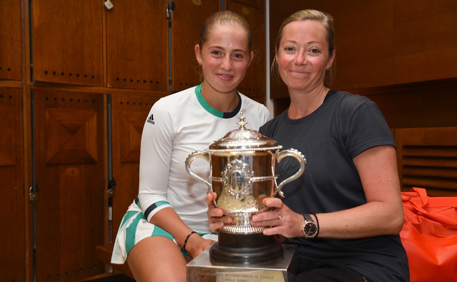 Jelena Ostapenko and her mother Jelena pose with the trophy in the locker room after winning the women's final match of the French Open. AP Jelena Ostapenko and her mother Jelena pose with the trophy in the locker room after winning the women's final match of the French Open. AP