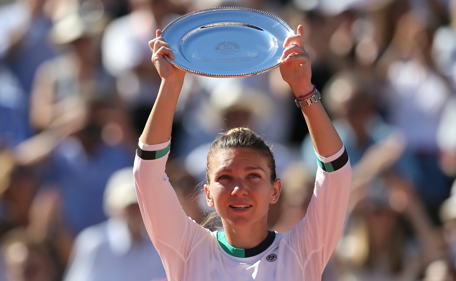 Halep holds her plate after losing to Ostapenko in three games. AP Halep holds her plate after losing to Ostapenko in three games. AP