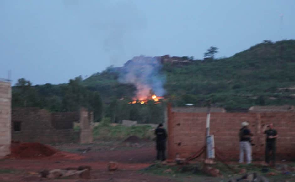 Smoke can be seen emanating from a fire near the swimming pool area of the Campement Kangaba resort in Bamako, Mali. AP Smoke can be seen emanating from a fire near the swimming pool area of the Campement Kangaba resort in Bamako, Mali. AP