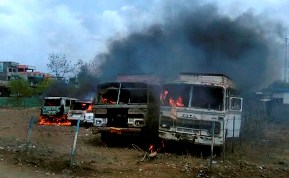 Chartered buses after being torched by agitating farmers at the Bhopal-Indore highway in Dewas district. PTI Chartered buses after being torched by agitating farmers at the Bhopal-Indore highway in Dewas district. PTI