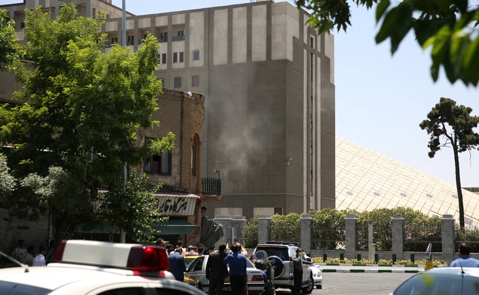 Smoke emanates at the Parliament building in central Tehran of Iran on Wednesday. Tima via Reuters Smoke emanates at the Parliament building in central Tehran of Iran on Wednesday. Tima via Reuters