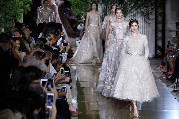 Models present creations by Zuhair Murad during the 2017-2018 fall/winter Haute Couture collection in Paris on July 5, 2017. AFP PHOTO Models present creations by Zuhair Murad during the 2017-2018 fall/winter Haute Couture collection in Paris on July 5, 2017. AFP PHOTO