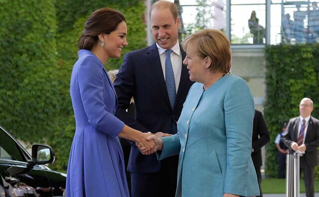 The first stop for the Duke and Duchess of Cambridge was a lunch of cod, tuna and salmon at the giant modern office complex of Chancellor Angela Merkel, widely considered the European Union's most powerful leader. AP The first stop for the Duke and Duchess of Cambridge was a lunch of cod, tuna and salmon at the giant modern office complex of Chancellor Angela Merkel, widely considered the European Union's most powerful leader. AP