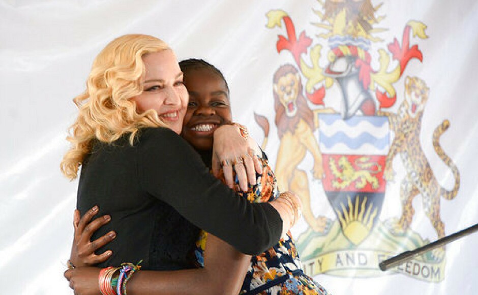Madonna, hugs her adopted girl, Mercy, at the opening of The Mercy James Institute for Pediatric Surgery and Intensive Care, located at the Queen Elizabeth Central Hospital in the city of Blantyre, Malawi. (AP Photo) Madonna, hugs her adopted girl, Mercy, at the opening of The Mercy James Institute for Pediatric Surgery and Intensive Care, located at the Queen Elizabeth Central Hospital in the city of Blantyre, Malawi. (AP Photo)