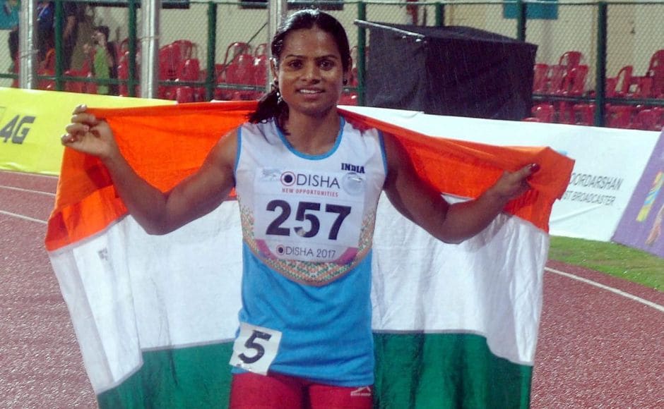 India's Dutee Chand celebrates after winning the bronze medal during the Women's 100m event. PTI India's Dutee Chand celebrates after winning the bronze medal during the Women's 100m event. PTI