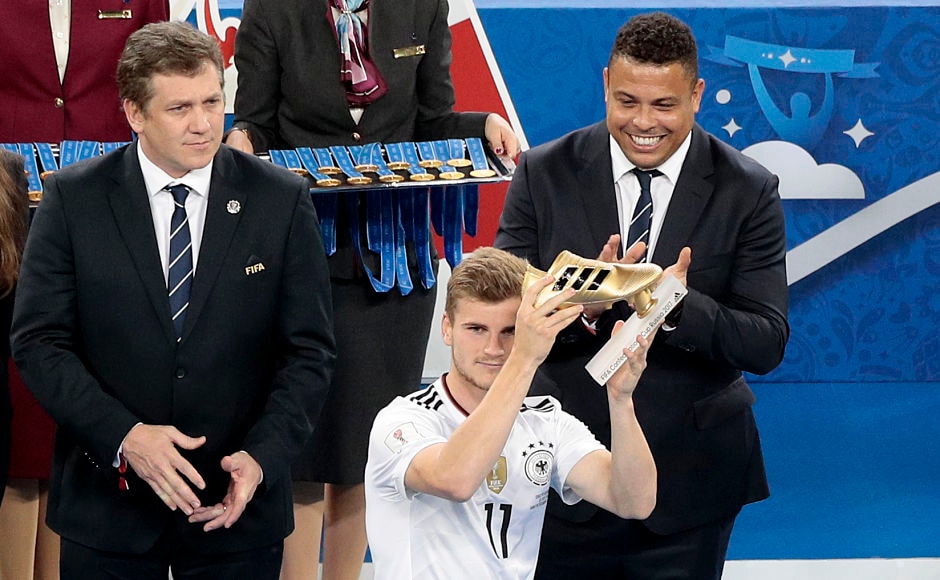 Germany's Timo Werner holds the Golden Boot of the competition as Brazilian footballer Ronaldo(R) looks on. AP Germany's Timo Werner holds the Golden Boot of the competition as Brazilian footballer Ronaldo(R) looks on. AP