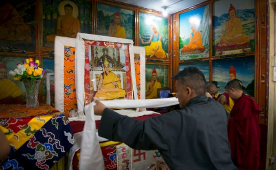 An exile Tibetan government official offers a ceremonial scarf 'khatag' in front of a portrait of the Dalai Lama to mark the Tibetan leader's 82nd birthday in Dharamsala. AP An exile Tibetan government official offers a ceremonial scarf 'khatag' in front of a portrait of the Dalai Lama to mark the Tibetan leader's 82nd birthday in Dharamsala. AP