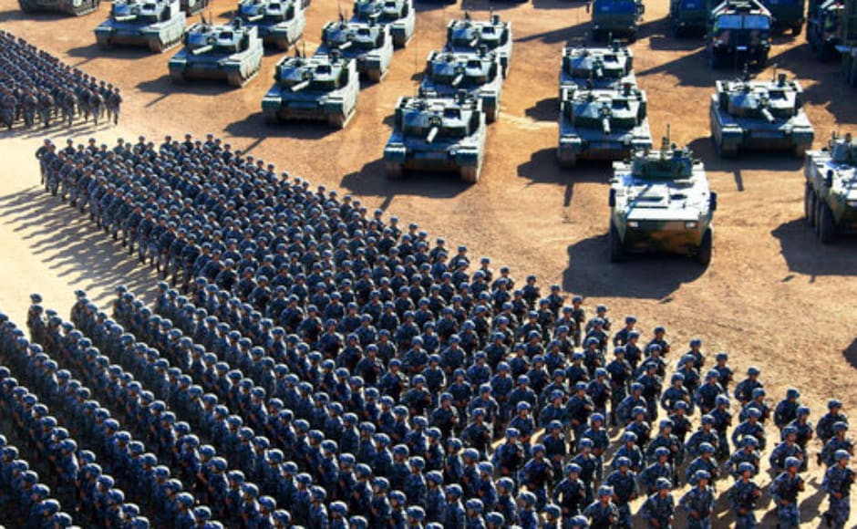 Chinese People's Liberation Army (PLA) troops march past military vehicles as they arrive for a military parade to commemorate the 90th anniversary of the founding of the PLA at Zhurihe training base in north China's Inner Mongolia Autonomous Region. AP Chinese People's Liberation Army (PLA) troops march past military vehicles as they arrive for a military parade to commemorate the 90th anniversary of the founding of the PLA at Zhurihe training base in north China's Inner Mongolia Autonomous Region. AP