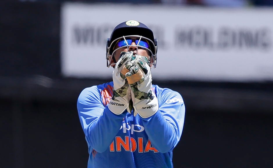 MS Dhoni pouches Chris Gayle's catch off Kuldeep Yadav's bowling but his wicket didn't change the game's situation at all. AP MS Dhoni pouches Chris Gayle's catch off Kuldeep Yadav's bowling but his wicket didn't change the game's situation at all. AP