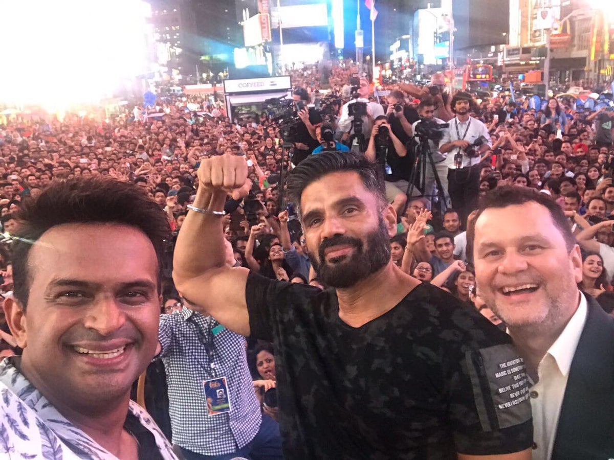 Suniel Shetty poses for a photo with his fans going crazy in the back. Image from Twitter/IIFA. Suniel Shetty poses for a photo with his fans going crazy in the back. Image from Twitter/IIFA.