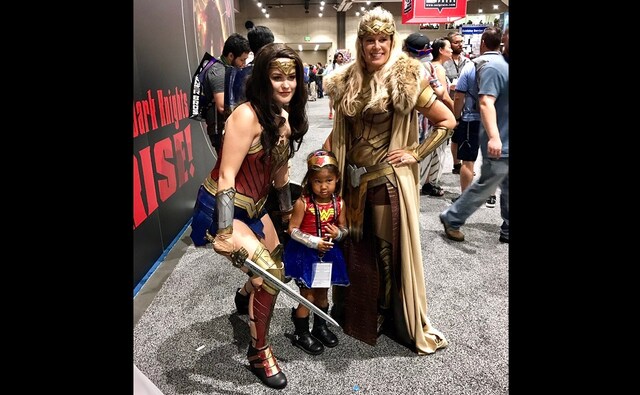Cosplayers dressed as Wonder Woman and Antiope pose with a child dressed as Wonder Woman. Image from Facebook Cosplayers dressed as Wonder Woman and Antiope pose with a child dressed as Wonder Woman. Image from Facebook
