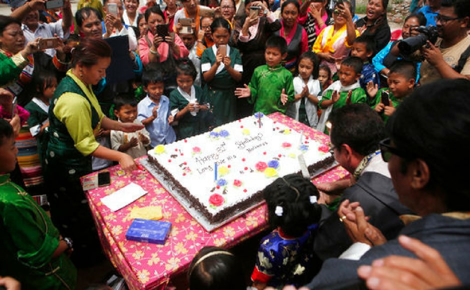 Tibetans gather to cut a cake in celebration of the 82nd birthday of their spiritual leader the Dalai Lama at a Tibetan camp in Lalitpur, Nepal on Tursday. AP Tibetans gather to cut a cake in celebration of the 82nd birthday of their spiritual leader the Dalai Lama at a Tibetan camp in Lalitpur, Nepal on Tursday. AP