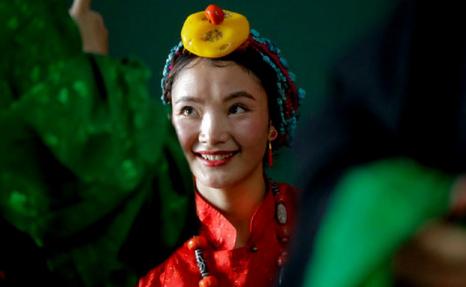 A dancer gears up for a performance in honour of the Dalai Lama in Nepal. AP A dancer gears up for a performance in honour of the Dalai Lama in Nepal. AP