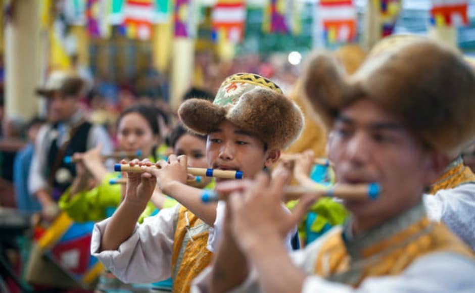 Performers at Dalai Lama's birthday celebrations in Dharamsala on Thursday. AP Performers at Dalai Lama's birthday celebrations in Dharamsala on Thursday. AP