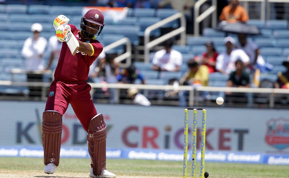 Evin Lewis plays a good looking drive before going bonkers. AP Evin Lewis plays a good looking drive before going bonkers. AP