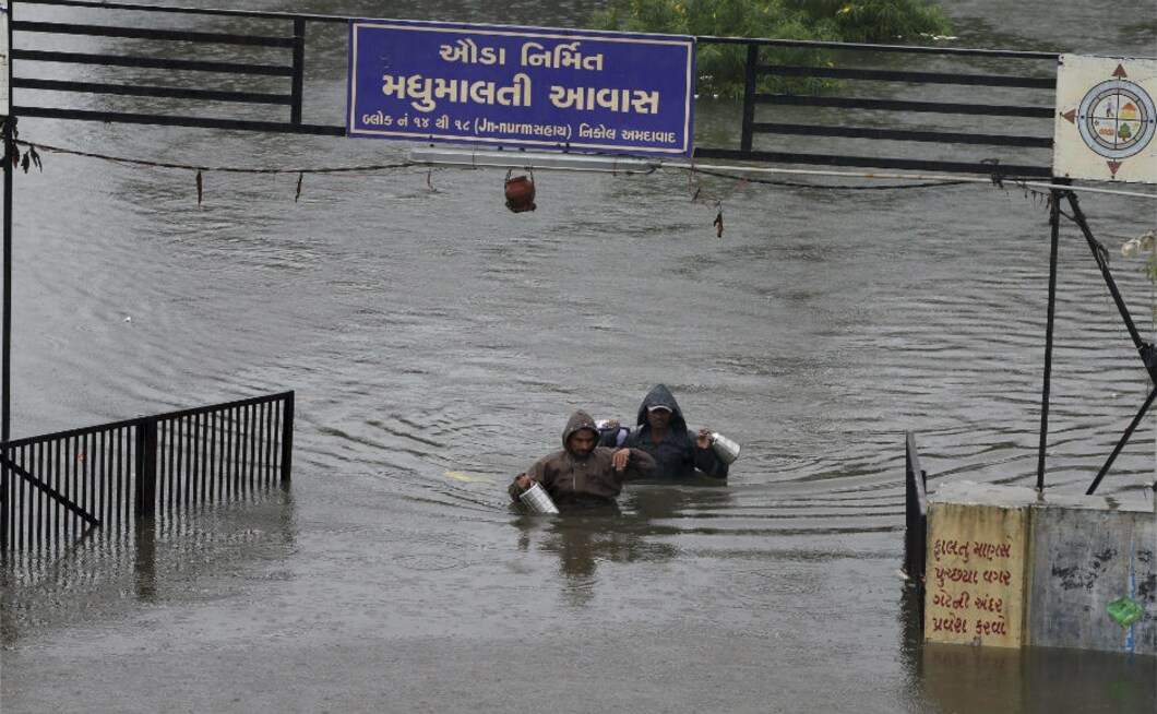 Ahmedabad alone received over 200 mm rainfall in 24 hours, forcing relocation of more than 10,000 people on Thursday. Several localities in the city were waterlogged. The death toll in Gujarat stood at 123 on Wednesday. PTI Ahmedabad alone received over 200 mm rainfall in 24 hours, forcing relocation of more than 10,000 people on Thursday. Several localities in the city were waterlogged. The death toll in Gujarat stood at 123 on Wednesday. PTI