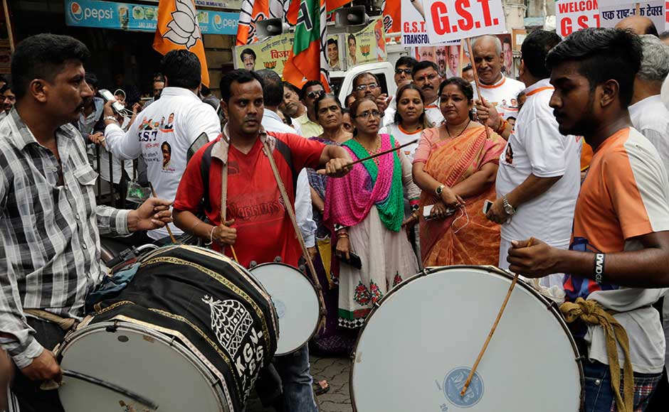 Bharatiya Janata Party (BJP) workers celebrate the implementation of the Goods and Services Tax (GST), India's biggest taxation reform since Independence, which came into force on Friday after 17 tumultuous years of debate, unifying more than a dozen central and state levies. AP Bharatiya Janata Party (BJP) workers celebrate the implementation of the Goods and Services Tax (GST), India's biggest taxation reform since Independence, which came into force on Friday after 17 tumultuous years of debate, unifying more than a dozen central and state levies. AP