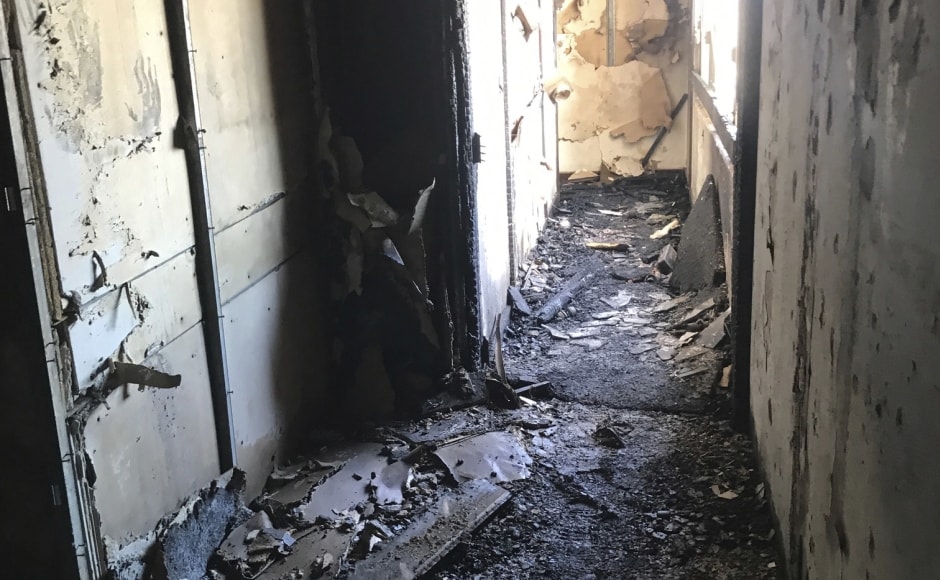 Fire chief Manuel Neves told reporters that the building did not have a sprinkler system. More than 100 firefighters tackled the fire and officers were conducting a room-by-room search, a task that could take several hours, he said. "We don't have any information for us to believe that there are problems with the structure," Neves added. AP Fire chief Manuel Neves told reporters that the building did not have a sprinkler system. More than 100 firefighters tackled the fire and officers were conducting a room-by-room search, a task that could take several hours, he said. "We don't have any information for us to believe that there are problems with the structure," Neves added. AP