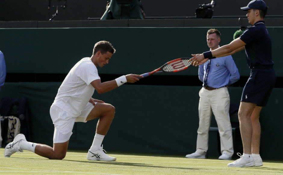 Canada's Vasek Pospisil falls after playing a shot on day two of the Wimbledon. AP Canada's Vasek Pospisil falls after playing a shot on day two of the Wimbledon. AP