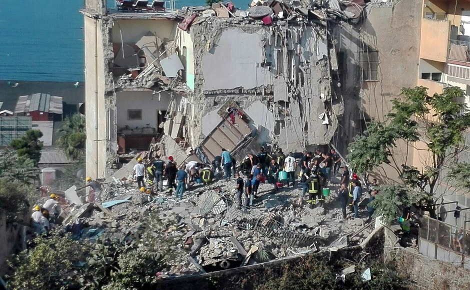 The structure collapsed partially and the interiors of some the apartments were visible. AP The structure collapsed partially and the interiors of some the apartments were visible. AP